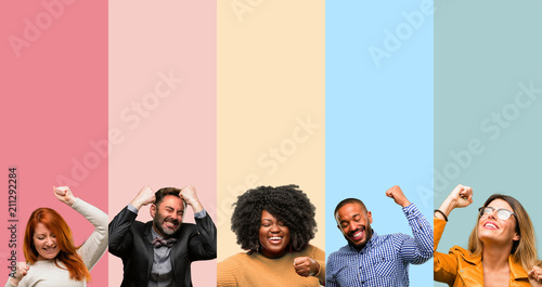 Cool group of people, woman and man happy and excited expressing winning gesture. Successful and celebrating victory, triumphant photo