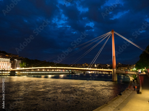 FRANCE - Illuminated footbridge Saint Georges and the old city, Vieux Lyon, in Lyon at dusk. May, 2018