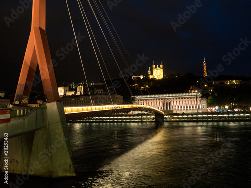 FRANCE - Illuminated footbridge Saint Georges and the old city, Vieux Lyon, in Lyon at dusk. May, 2018 photo