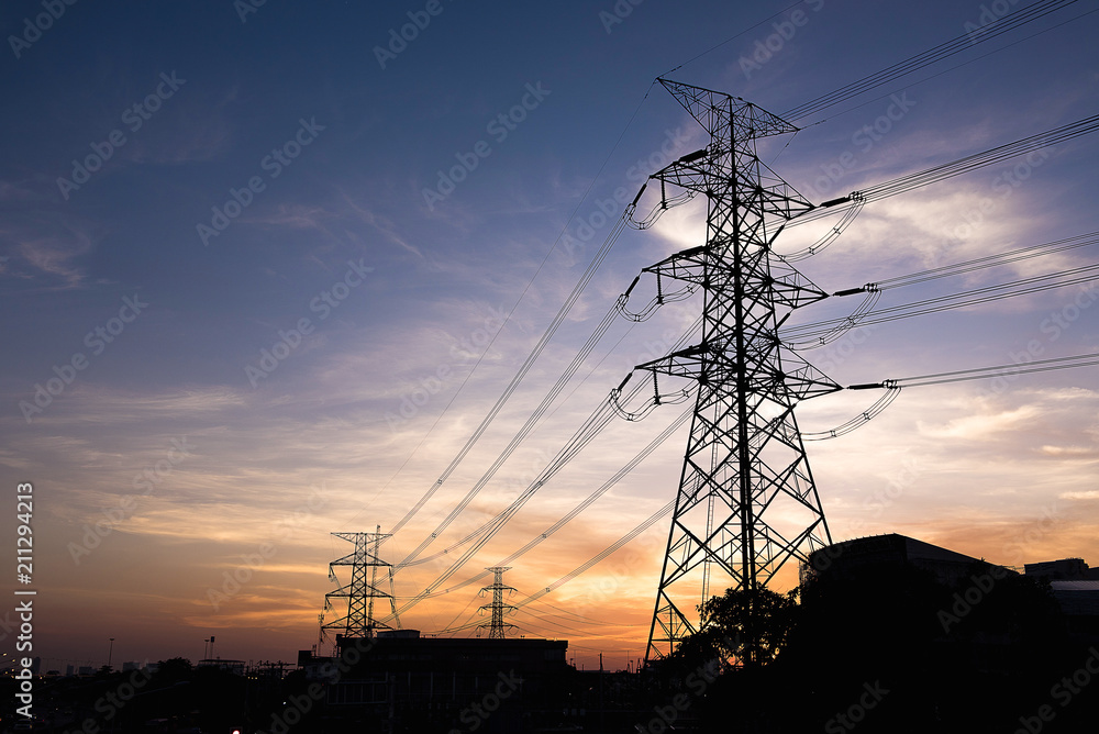 Silhouette high voltage post or High voltage tower with twilight 