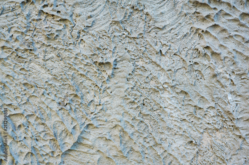 Stone texture, the surface of solidified concrete in gray tones. Abstract background.