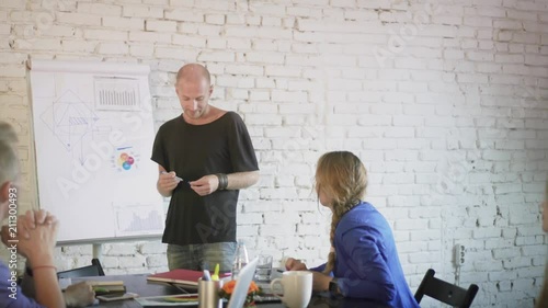 Business team discussing new startup ideas on the business meeting. Coworkers in the office communicate and planning