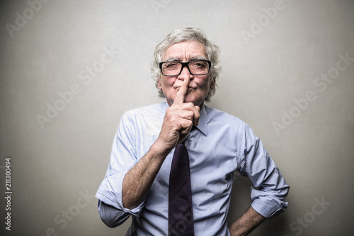 Elderly man asking for silence