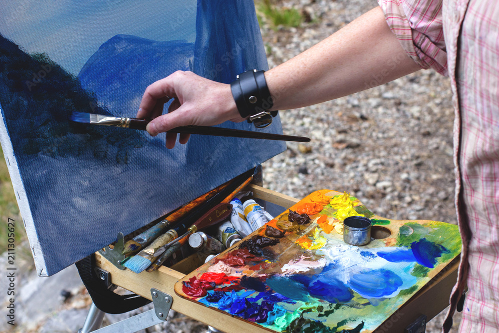hand painter paints a picture hand painter paints a picture
