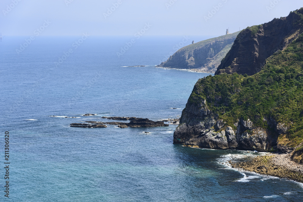 San Juan de Gaztelugatxe in front of the hermitage on the coast of Vizcaya San Juan de Gaztelugatxe in front of the hermitage on the coast of Vizcaya