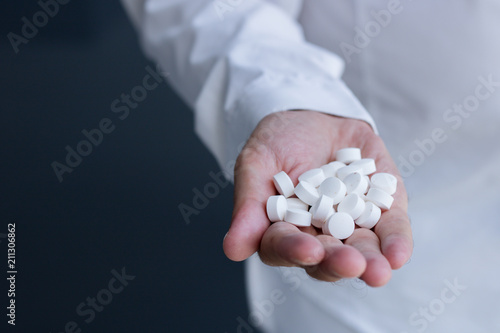 Hand full of pills.