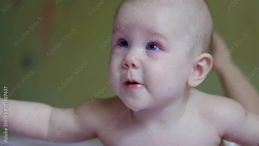 portrait of a happy baby with blue eyes portrait of a happy baby with blue eyes