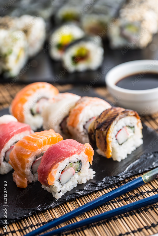 Set of roll sushi gold california with chopsticks and soy sauce. Set of roll sushi gold california with chopsticks and soy sauce.
