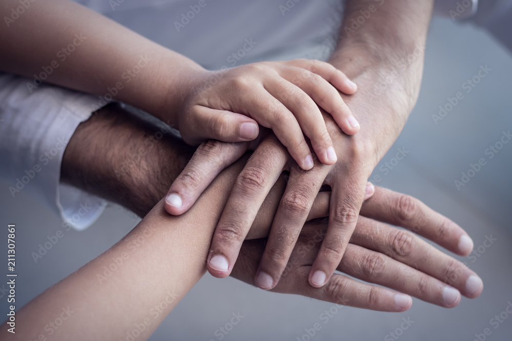 United hands of father and son. United hands of father and son.