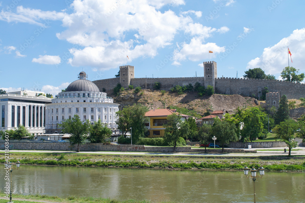 The walls of Kale Fortress over government buildings on the banks of the Vardar River in Skopje