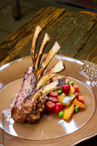 Lamb rack with limoncello glaze served on a plate photo