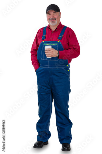 Full length portrait of a worker in dungarees