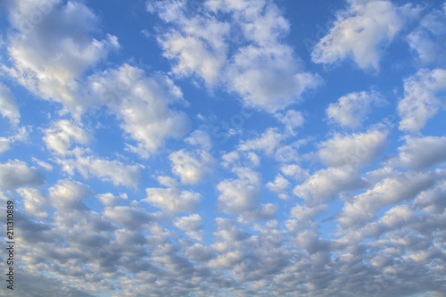 Background of beautiful  sky with clouds. Cirrocumulus. Looking up view. Close Up. Abstract natural  sky background. photo