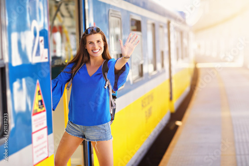 Young woman tourist at platform train station