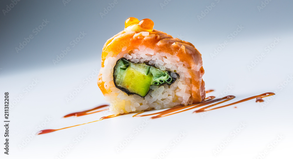 Close-uo Philadelphia roll sushi with soy sauce. Close-uo Philadelphia roll sushi with soy sauce.