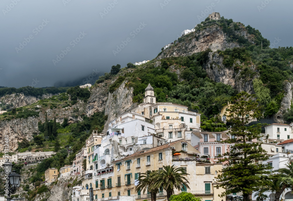 Dark clouds loom over the town of Amalfi, Salerno, Campania, Italy