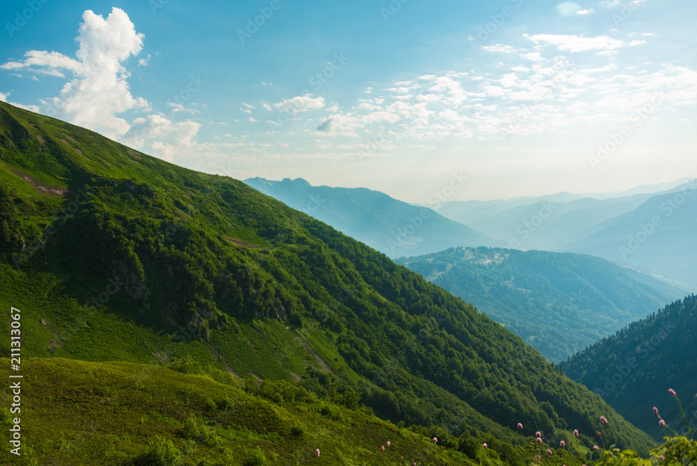 The Grand Canyon of the Bzerpi River. High mountain peaks and blue sky. Mountain tourism. The Grand Canyon of the Bzerpi River. High mountain peaks and blue sky. Mountain tourism.