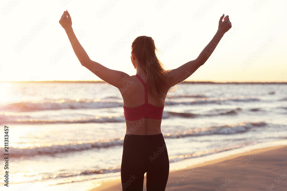 Woman running alone at beautiful dusk on the beach Woman running alone at beautiful dusk on the beach