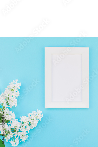 Blank frame mockup with white flowers