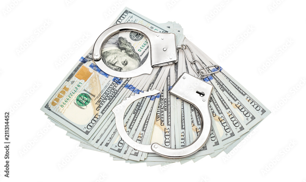 Opened handcuffs with dollar bills on white background. Top view. Opened handcuffs with dollar bills on white background. Top view.