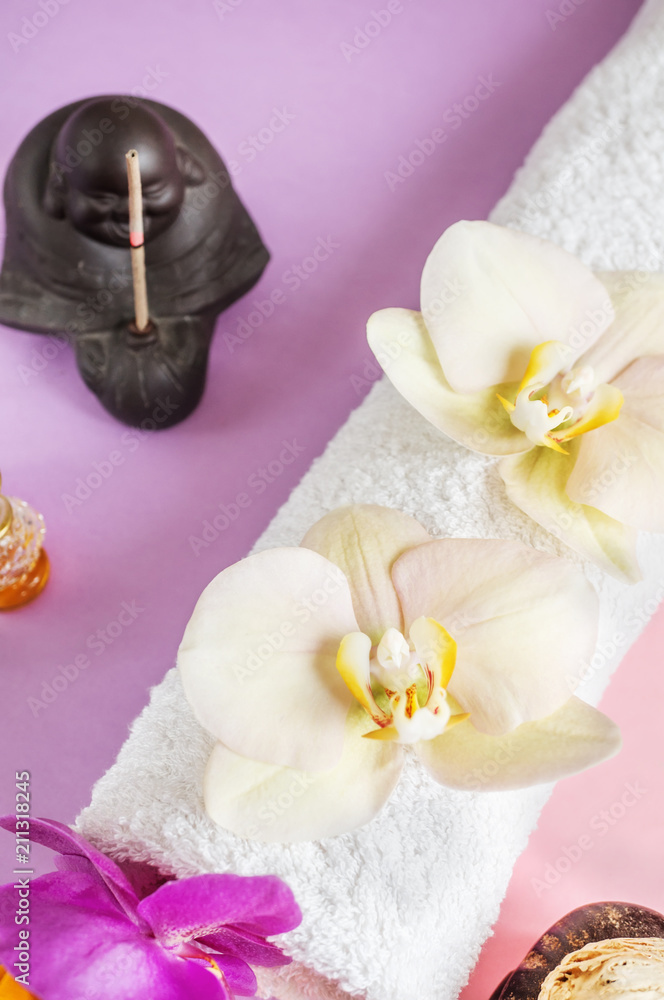 Beautiful soap in the form of flowers and towel with lavender flowers for Spa treatments on a two-tone background. Beautiful soap in the form of flowers and towel with lavender flowers for Spa treatments on a two-tone background.