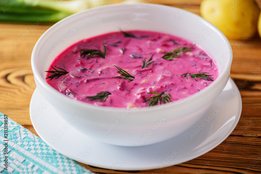 Cold beetroot (beet) soup on yogurt with egg, onion and cucumbers Cold beetroot (beet) soup on yogurt with egg, onion and cucumbers