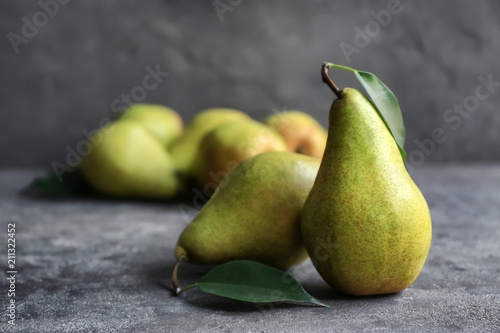 Delicious ripe pears on table