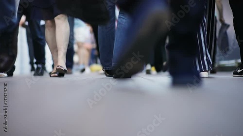 people feet closeup walking outside on the street human crowd many legs going urban busy lifestyle vanity bustle casual shoes slow motion selective focus worldwide traveling feet pedestrians crossing