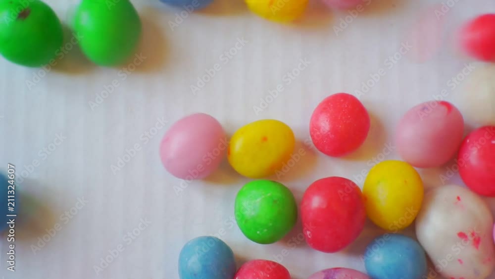 small glazed candies of different colors.closeup.abstract moving background for your design small glazed candies of different colors.closeup.abstract moving background for your design