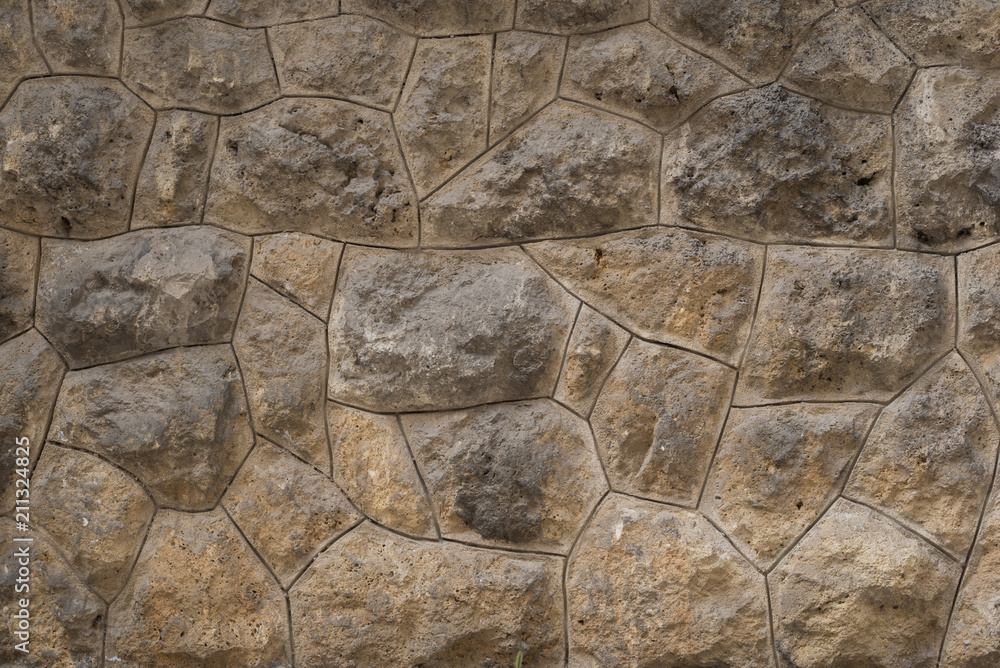 Old stone wall as texture or background. Old exterior wall with big rocks. Old stone wall as texture or background. Old exterior wall with big rocks.