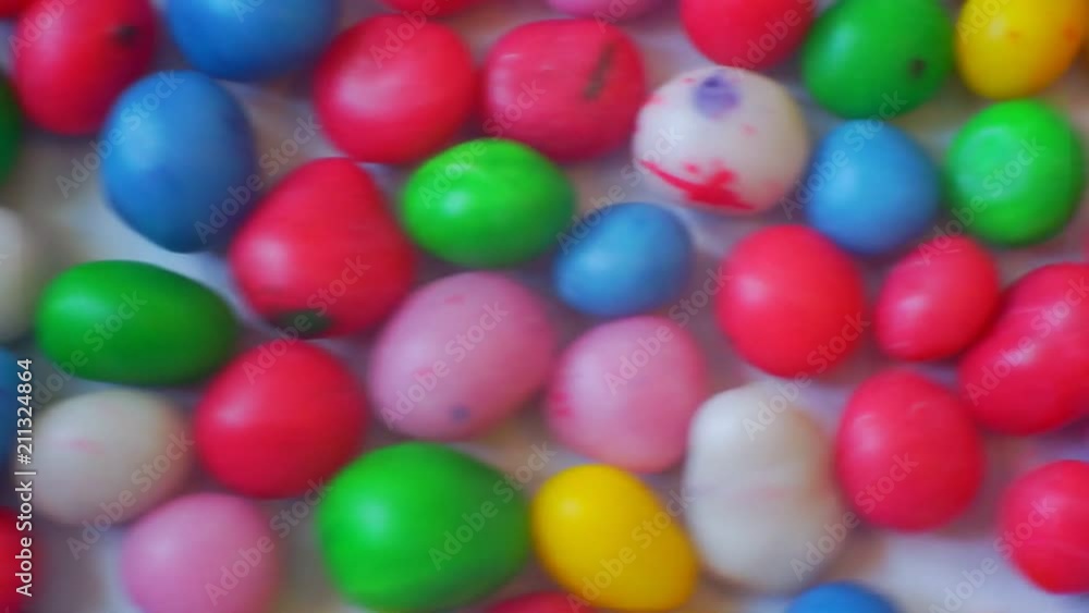 small glazed candies of different colors.closeup.abstract moving background for your design small glazed candies of different colors.closeup.abstract moving background for your design