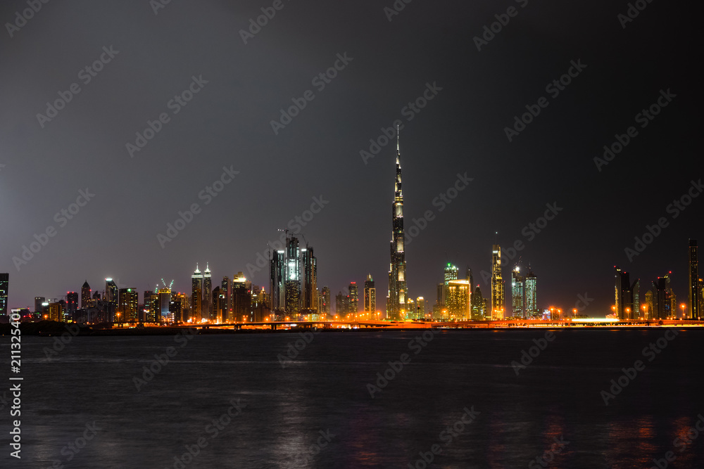 Dubai panorama at night, UAE - warm colors 