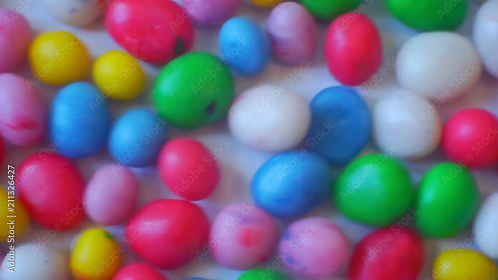 small glazed candies of different colors.closeup.abstract moving background for your design. small glazed candies of different colors.closeup.abstract moving background for your design.