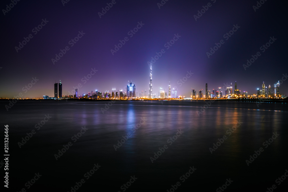 Skyline of Dubai city illuminated at night