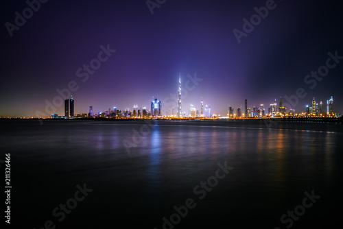 Skyline of Dubai city illuminated at night