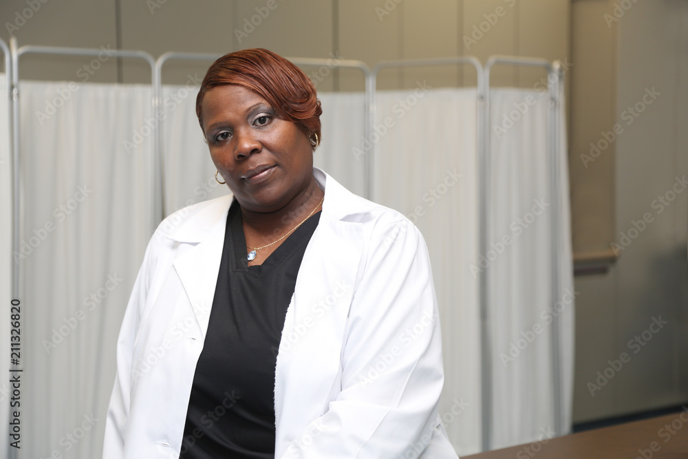 Portrait of a young robust African American woman, portrait of female doctor in a medical clinic Portrait of a young robust African American woman, portrait of female doctor in a medical clinic
