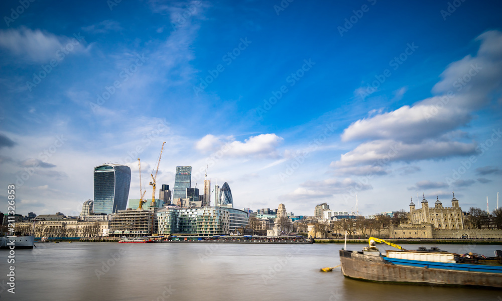 Obraz premium Skyscrapers and cranes in financial district in London. England