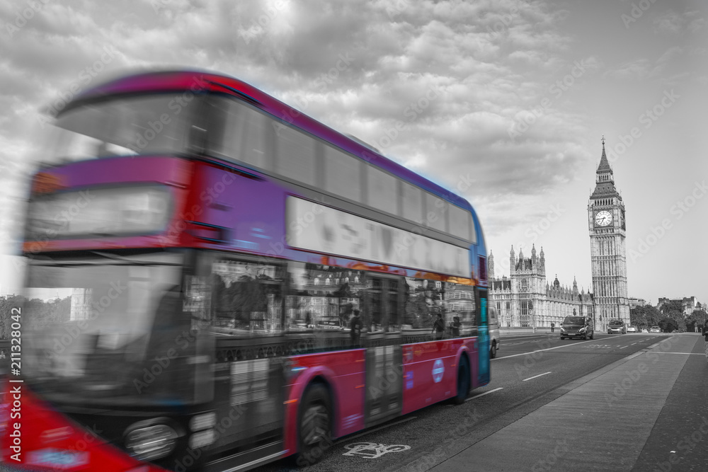 Abstract view of red double decker bus in motion with Big Ben in the background