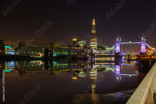 Tower Bridge illuminated at night in London. England