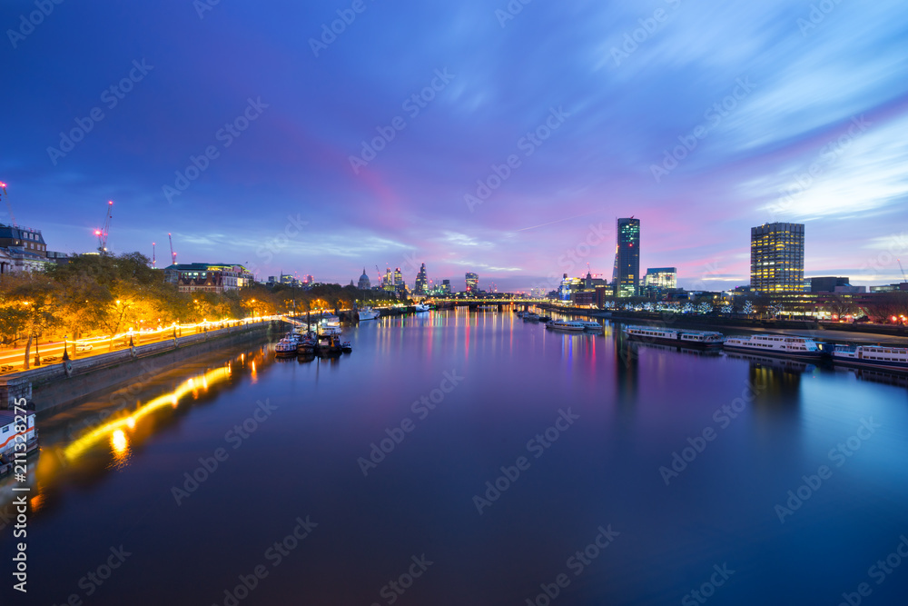 London skyline panorama at sunrise seen across river thames. England