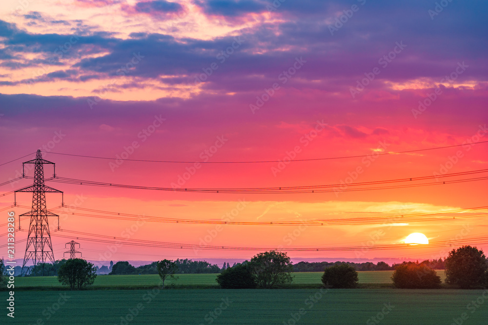 Fototapeta premium Electric transmission tower at sunset