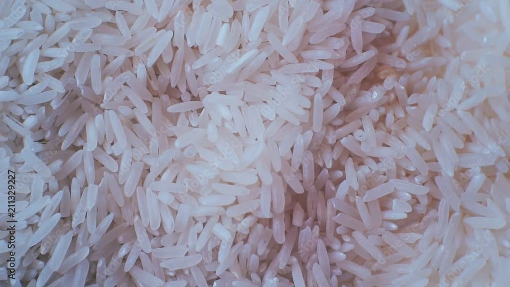 peeled ripe grain of rice.closeup.motion background. peeled ripe grain of rice.closeup.motion background.