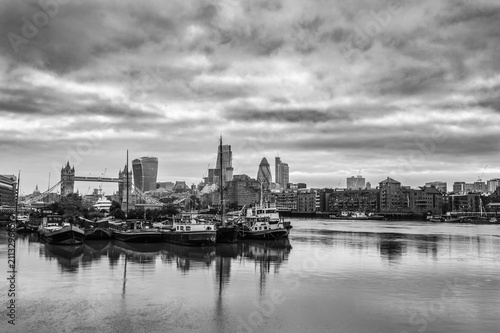 Black and white skyline of London overlooking Tower Bridge and financial district 