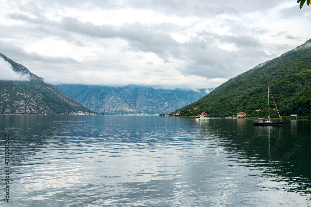 Romantic Mediterranean cloudly landscape. Montenegro, view of Bay of Kotor.