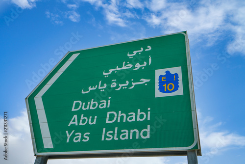 Photography Road sign in United Emirates against blue sky