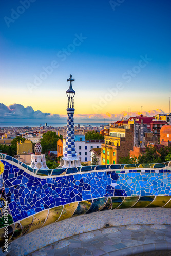 Barcelona cityscape at sunrise seen from public park Guell 