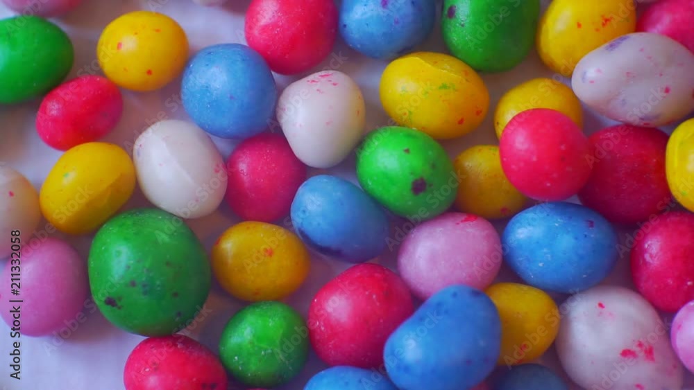 small glazed candies of different colors.closeup.abstract moving background for your design. small glazed candies of different colors.closeup.abstract moving background for your design.