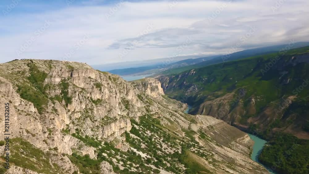 Mountain landscape. A beautiful view of the picturesque gorge, a panorama with high mountains. The nature of the North Caucasus, rest in mountains Mountain landscape. A beautiful view of the picturesque gorge, a panorama with high mountains. The nature of the North Caucasus, rest in mountains
