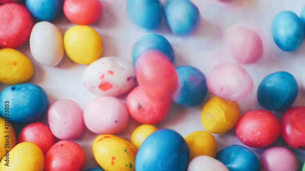 small glazed candies of different colors.closeup.abstract moving background for your design. small glazed candies of different colors.closeup.abstract moving background for your design.