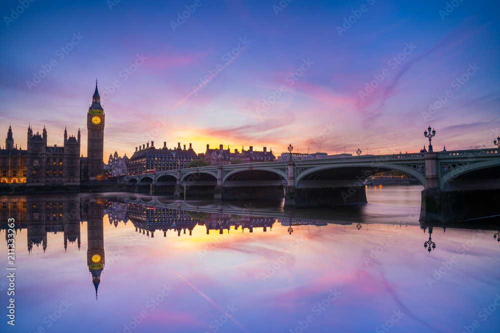 Westminster Bridge and Big Ben clock at sunset in London. England
